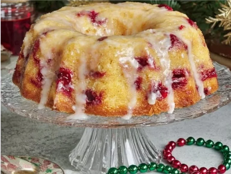 Sliced Cranberry Orange Bundt Cake on a decorative plate
