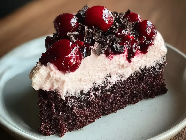 Chocolate cake with cherry topping served on a plate