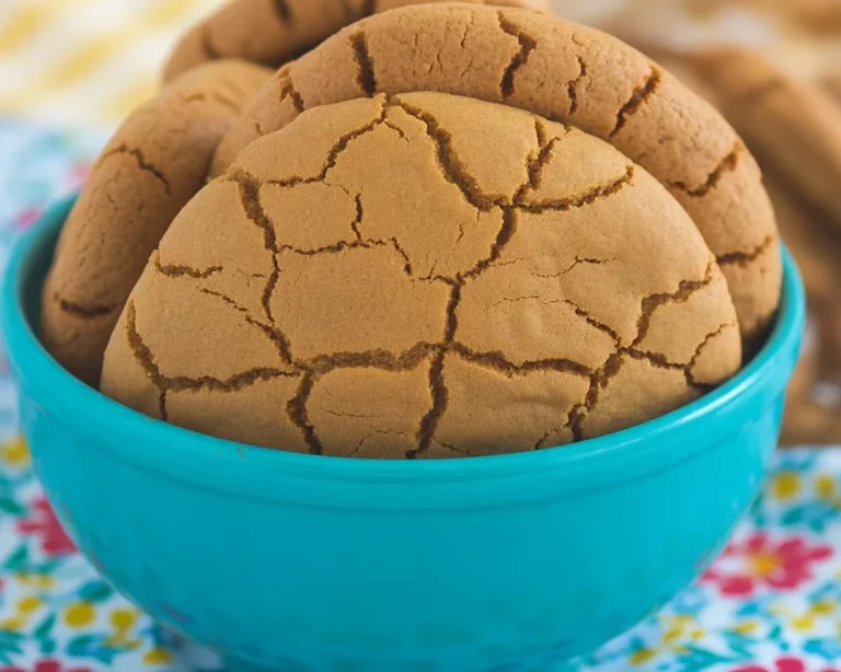 Baked Small Batch Soft Gingerbread Cookies decorated with icing on a festive plate.