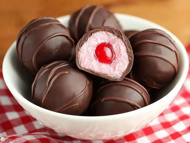 Delicious easy chocolate covered cherries on a white plate