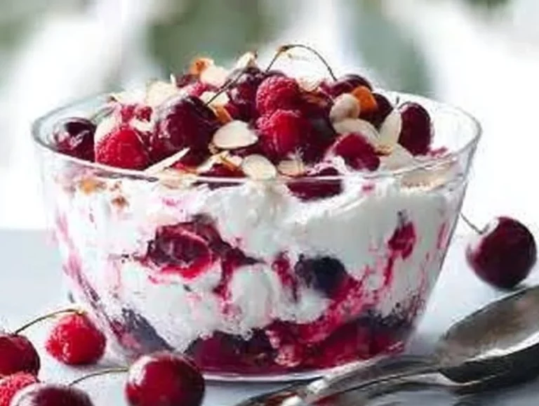 Smashed Pavlova Cherry Trifle dessert with layers of pavlova, cream, and cherries