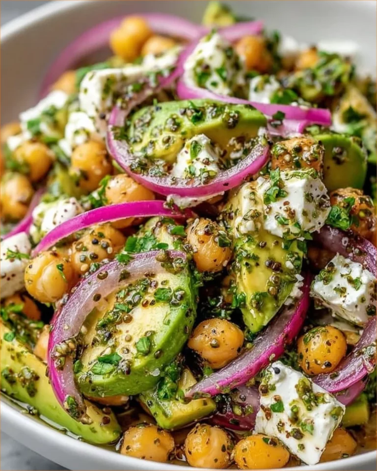 Chickpea Feta Avocado Salad served in a bowl with vibrant veggies and herbs