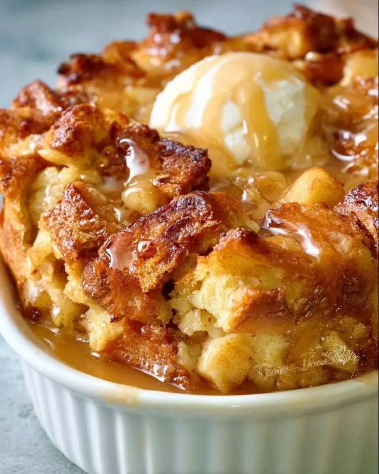 Cozy Canadian apple pie bread pudding dessert served in a warm bowl