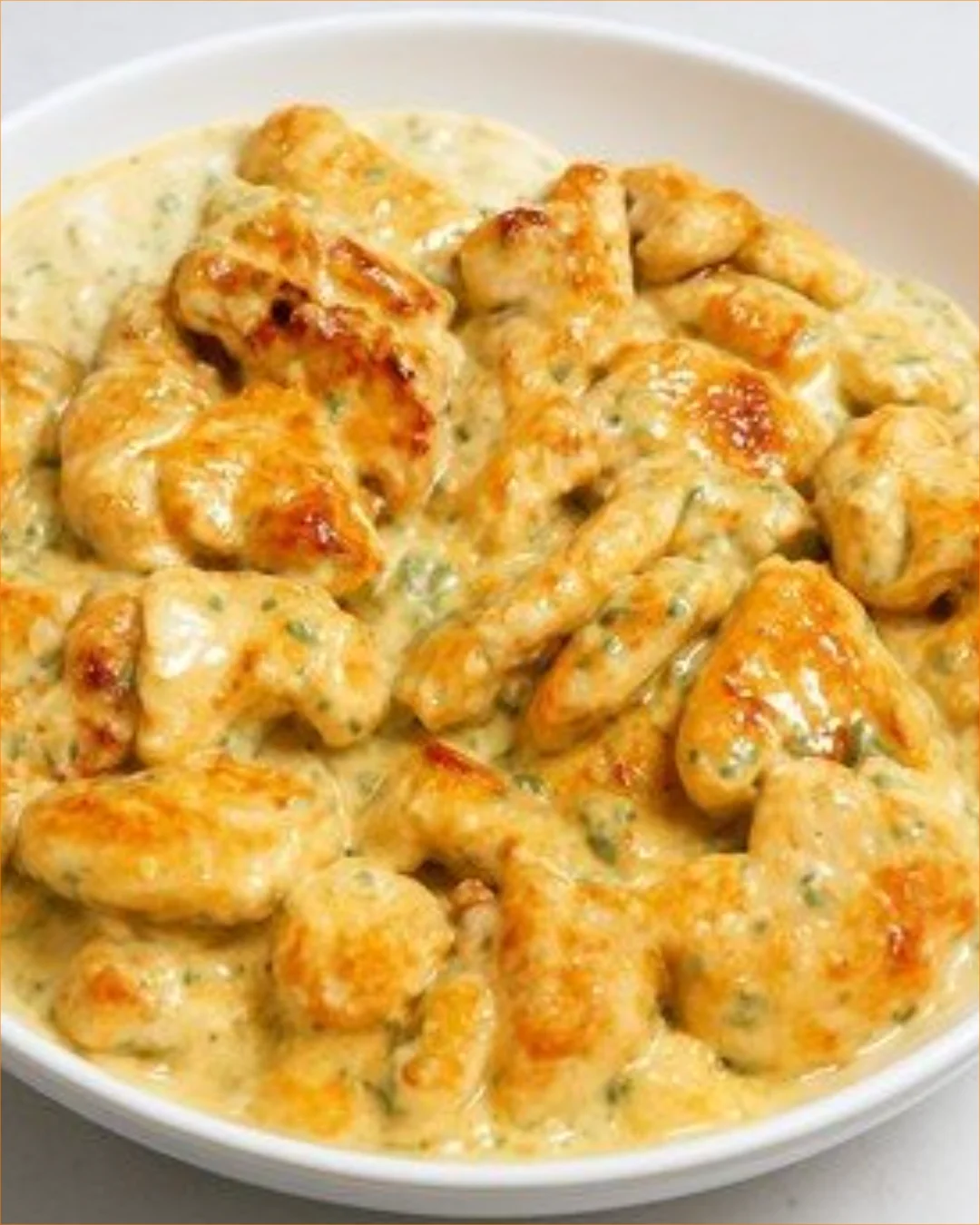 Creamy lemon herb chicken bites served on a plate