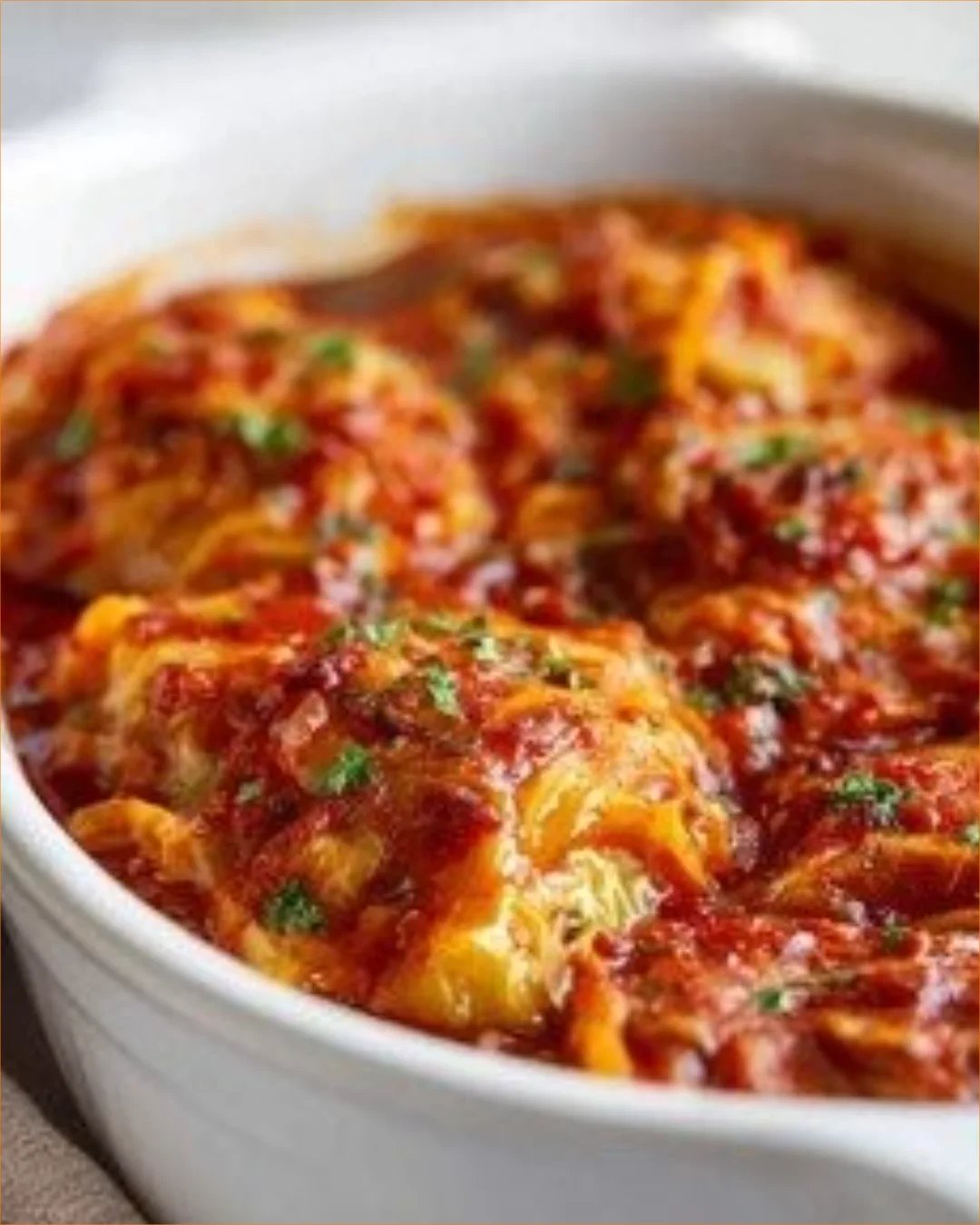Delicious crockpot cabbage roll casserole served in a bowl with fresh herbs on top