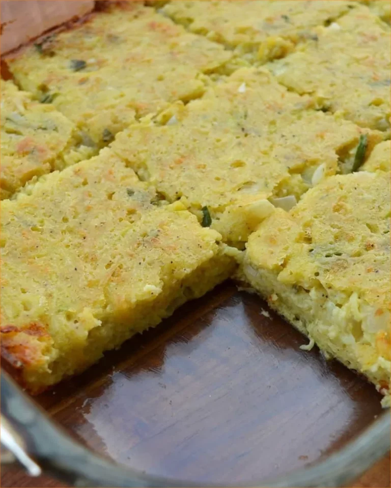 Delicious easy cheesy zucchini casserole dish with melted cheese on top.