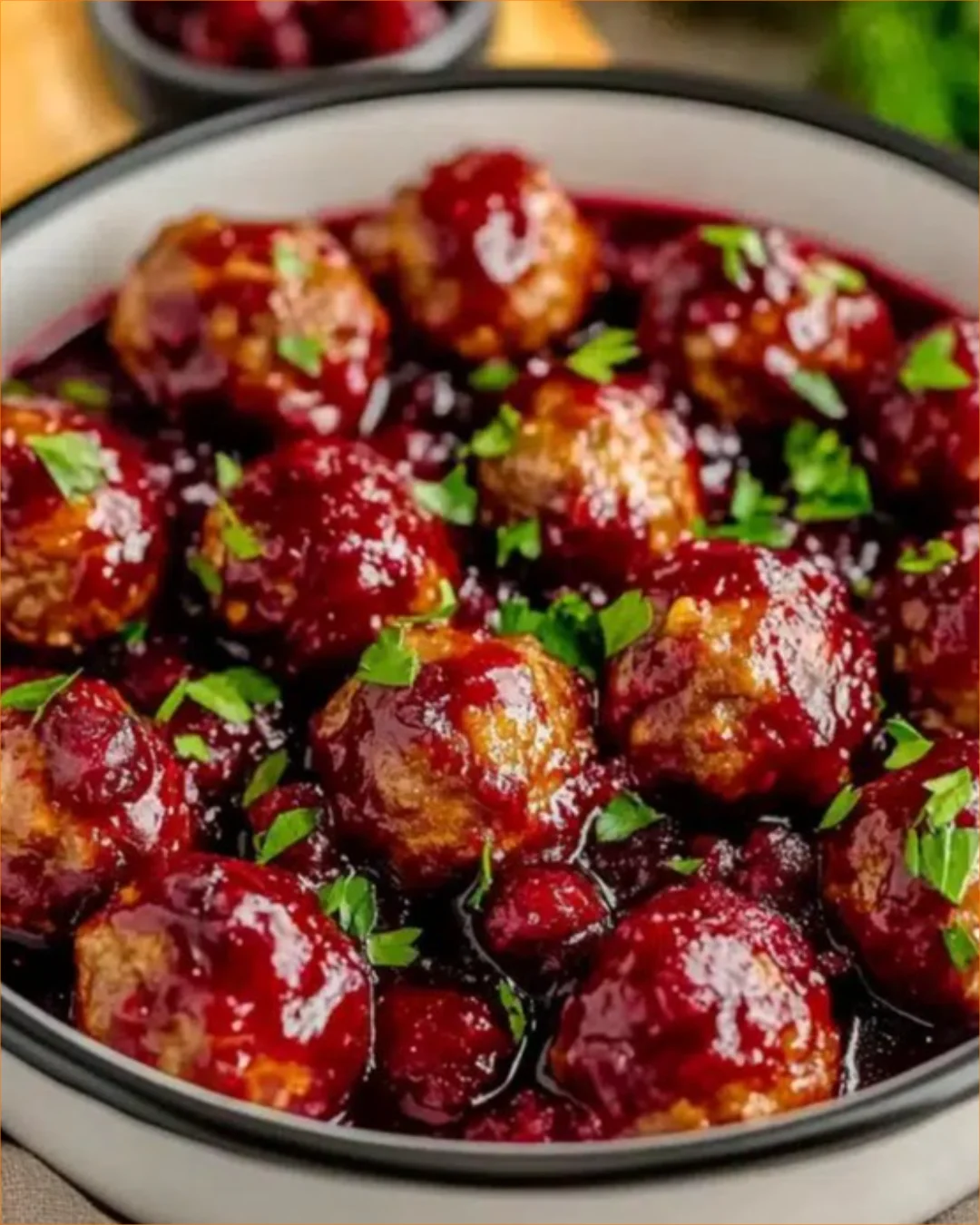 Quick Christmas cranberry meatballs served on a festive platter