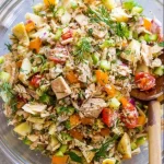 Bowl of fresh and colorful tuna salad with vegetables.