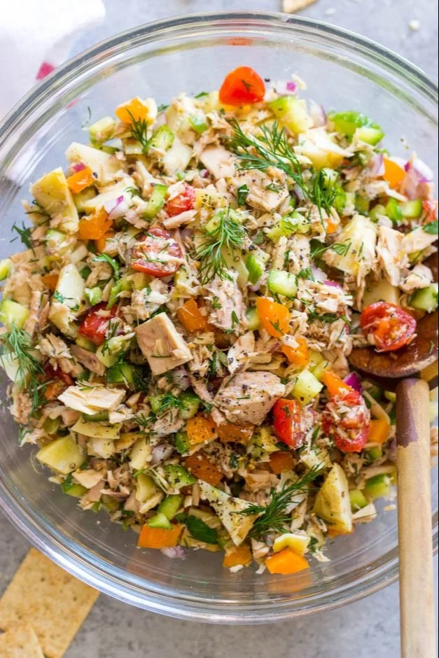 Bowl of fresh and colorful tuna salad with vegetables.