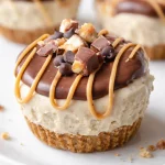 Flourless Frozen Peanut Butter Pie Cups topped with creamy peanut butter and chocolate.