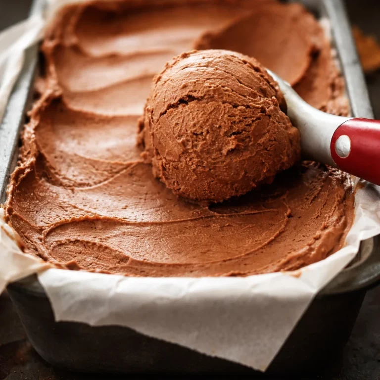 Delicious small-batch chocolate date ice cream served in a bowl with chocolate chips.