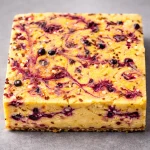 No-Bake Frozen Vanilla Protein Cheesecake Squares with a creamy filling and graham cracker crust