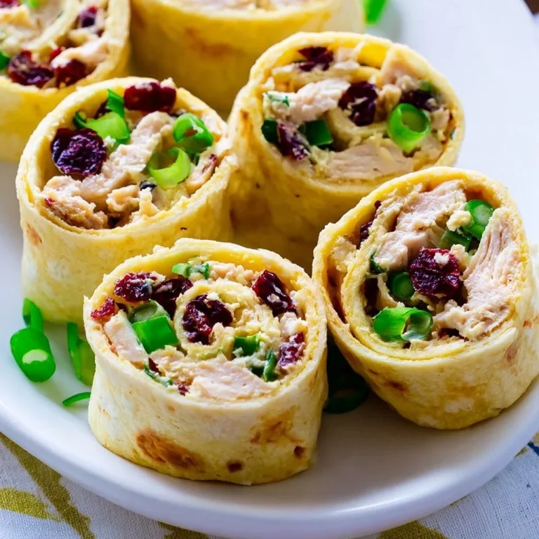 Creamy chicken tortilla roll-ups on a serving platter