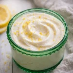 Cottage Cheese Lemon Mousse Cups topped with lemon zest in two small jars