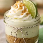 No-Bake Key Lime Cheesecake Cups with graham cracker crust and whipped cream topping