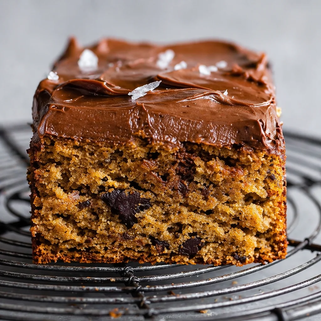 Flourless Tahini Banana Snack Cake topped with chocolate buttercream for a healthy treat