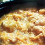 Slow-Cooker Chicken and Dumplings in a bowl, showcasing tender chicken and fluffy dumplings.